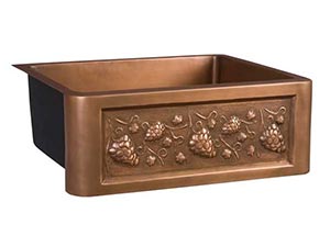 Single bowl copper farmer sink with grape motif front