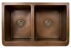 Top view of offset double bowl copper farmer sink