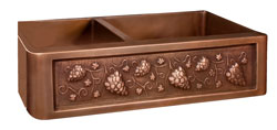 Double bowl copper farmer sink with grape motif