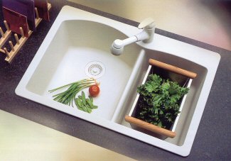 stainless steel colander in kitchen sink