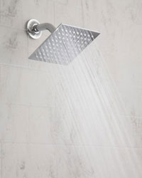 Example of an installed sqaure Rain Machine shower head, shown in chrome