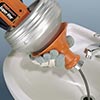 Using a drill style drain cleaner