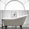image of a slipper style cast iron clawfoot tub, shown in white