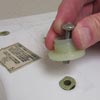 Installing a toilet seat on a one-piece toilet
