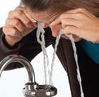 an image of the eyePOD™ in use flushing out a persons eyes