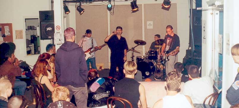 Ian in 1999 playing guitar