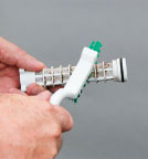 an image of someone cleaning their mesh screen filter by hand