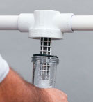 an image of the housing being reinstalled to a spin-down filter system