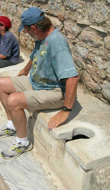 Vic in Turkey sitting on a 2000 year old toilet.